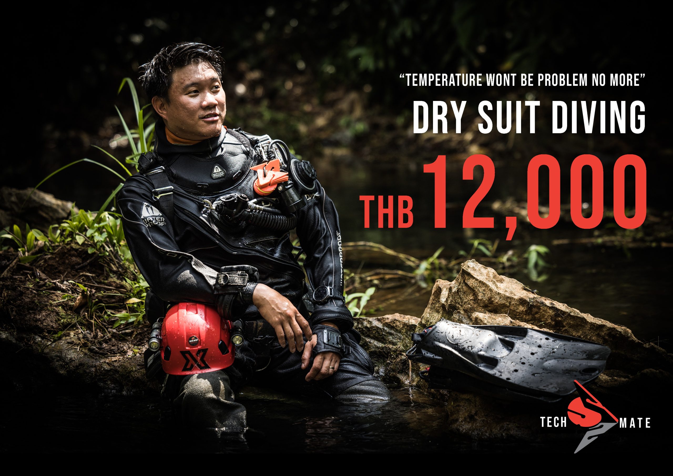 Diver seated by a jungle stream in drysuit gear, Drysuit Diving course